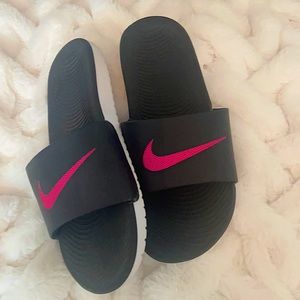 Black and Pink Nike slides